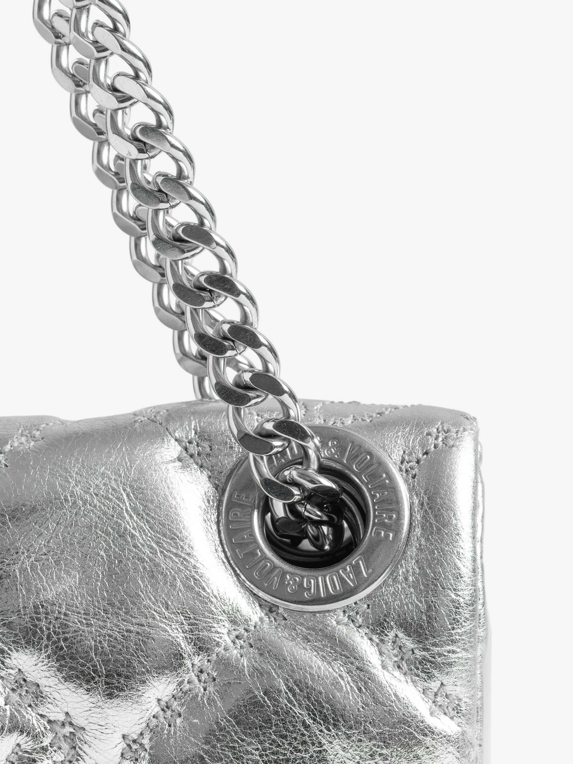 Rock II Metal Monogram Clutch - Pochette in quilted metallic leather with sliding metal chain and signature wings.